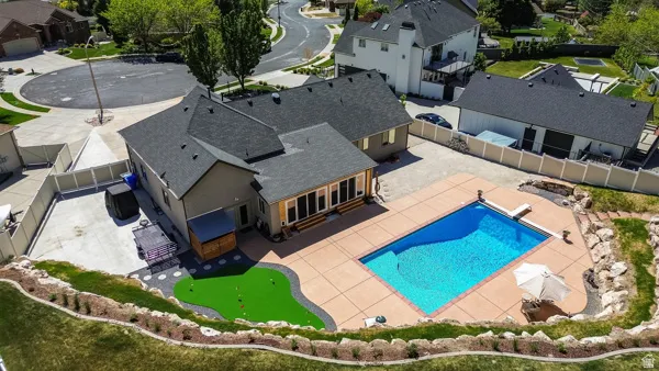 Beautiful 1/2 Acre Lot with Pool, Putting Green, Large Patio, & Games