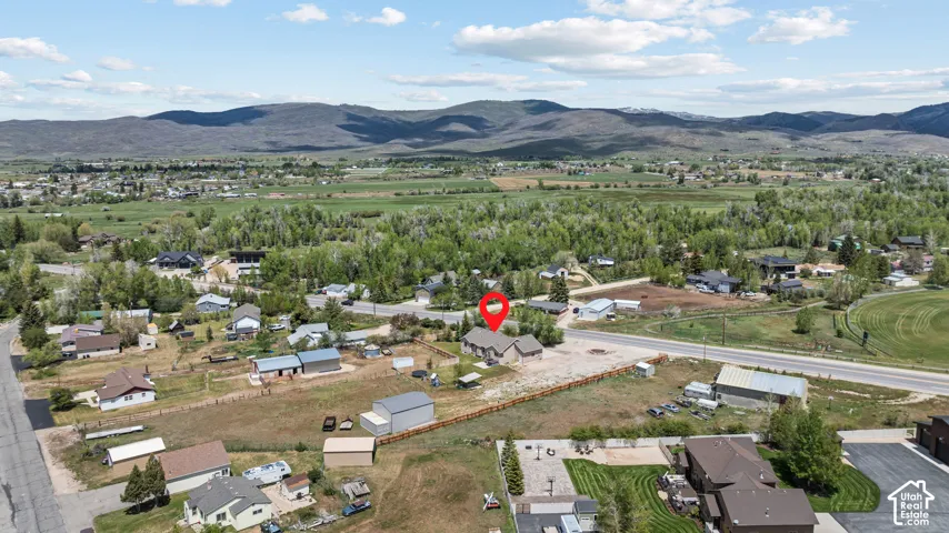 Expansive aerial perspective showcasing the property's prominent positioning within a rural landscape