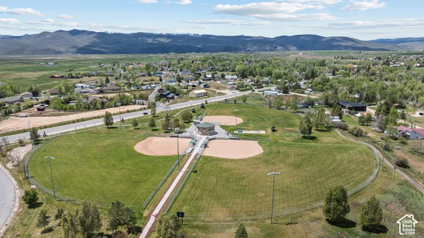 Expansive community sports complex featuring multiple baseball fields with manicured outfields and infields