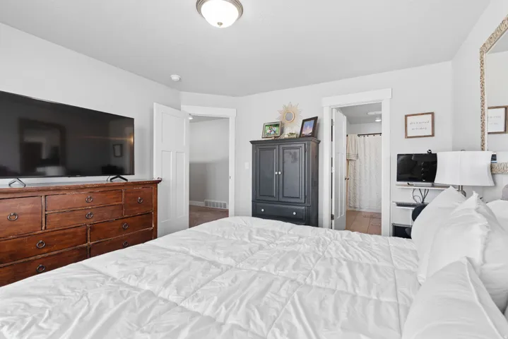 Bright bedroom with light gray walls and white trim