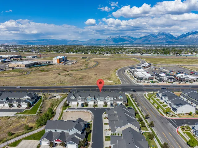 Aerial perspective showcasing a residential development with mountain scenery
