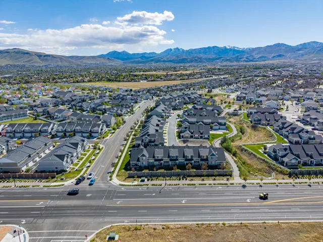 Aerial perspective showcasing a residential community with a mountain backdrop