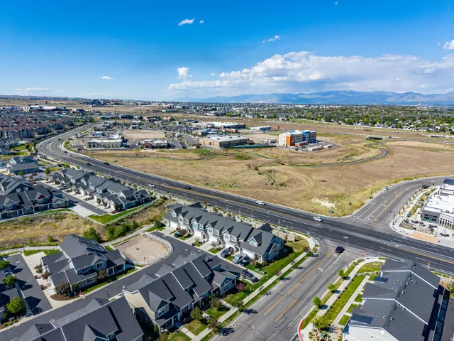 Aerial perspective showcasing a residential development with multiple townhome-style units