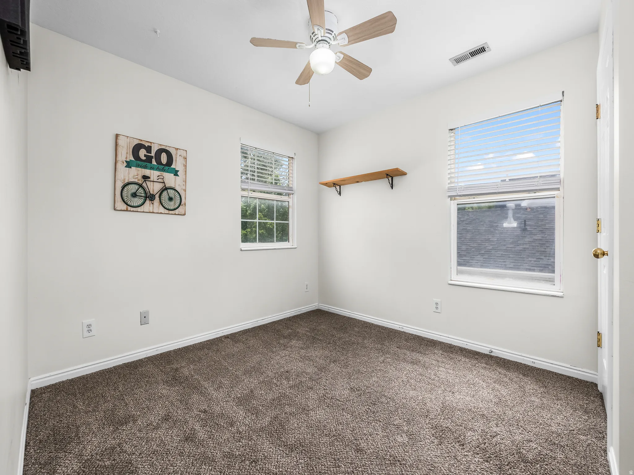 Bed 4 Neutral wall tones complement the durable carpet flooring