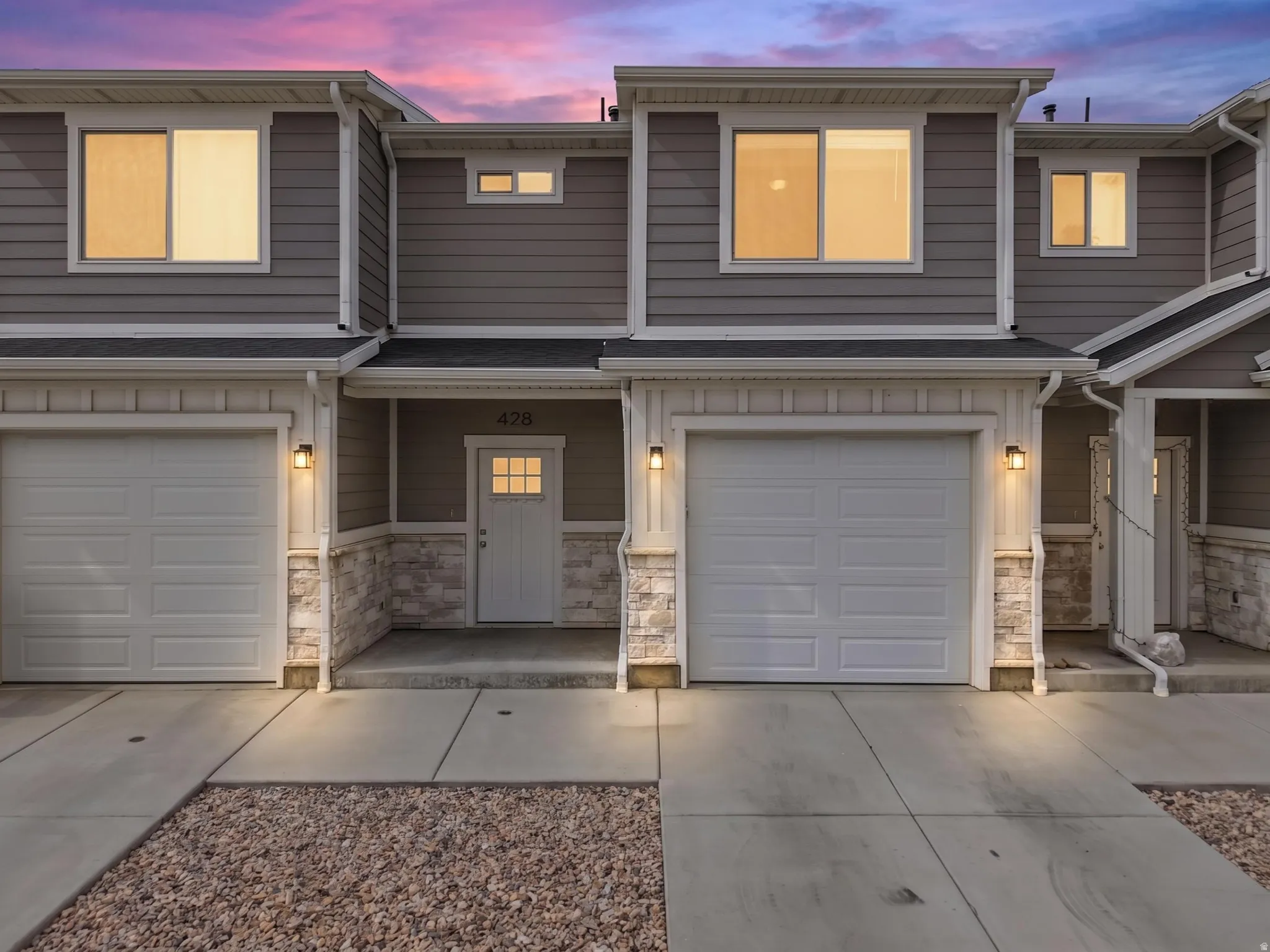 Modern gray siding exterior with stone accents