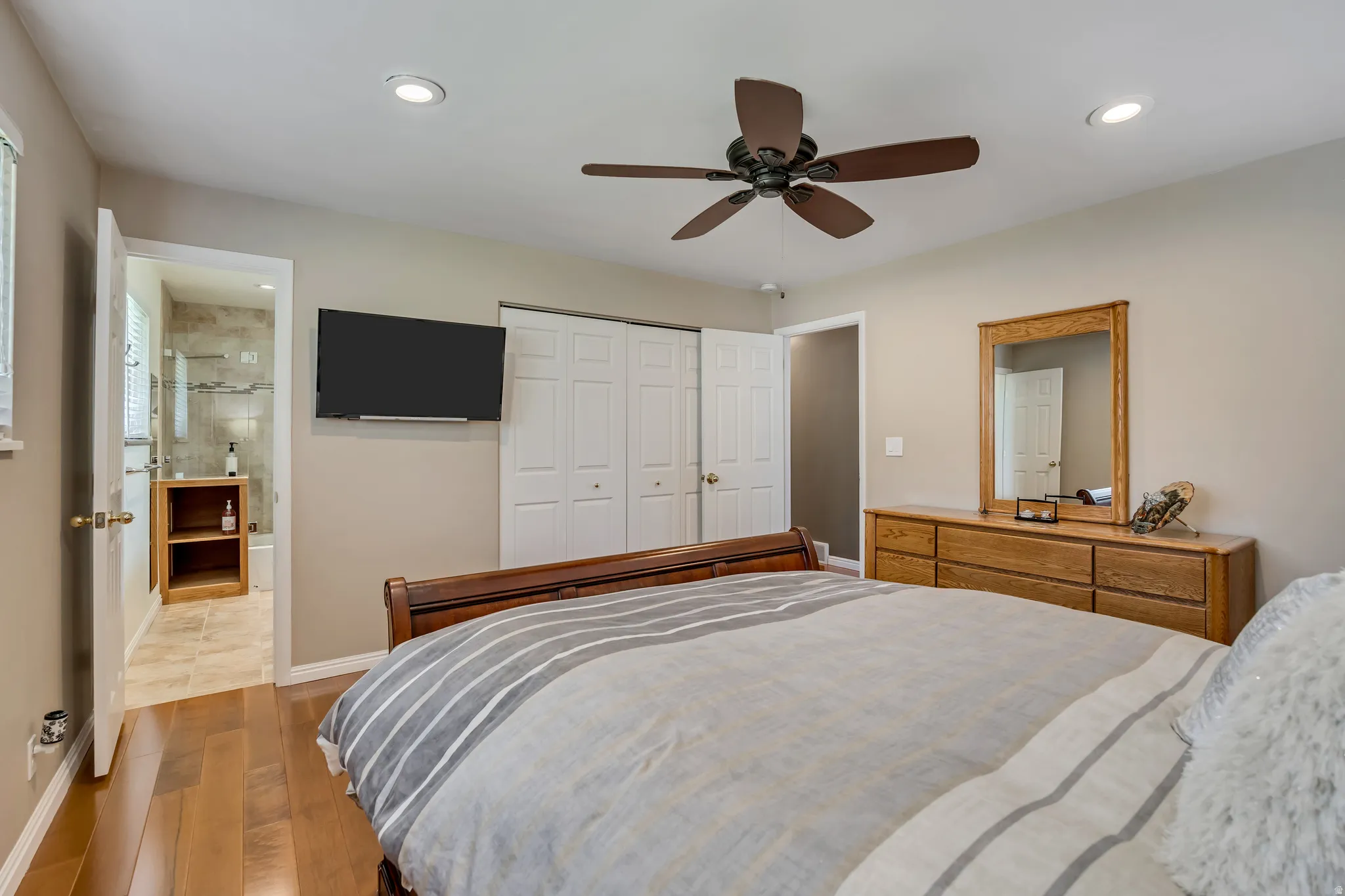 Bedroom featuring wood-finish flooring, recessed lighting, and a ceiling fan
