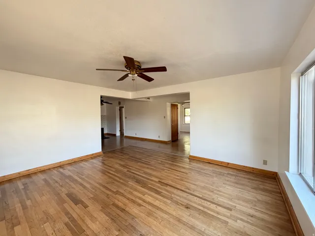 Hardwood flooring and light-toned walls define this interior space