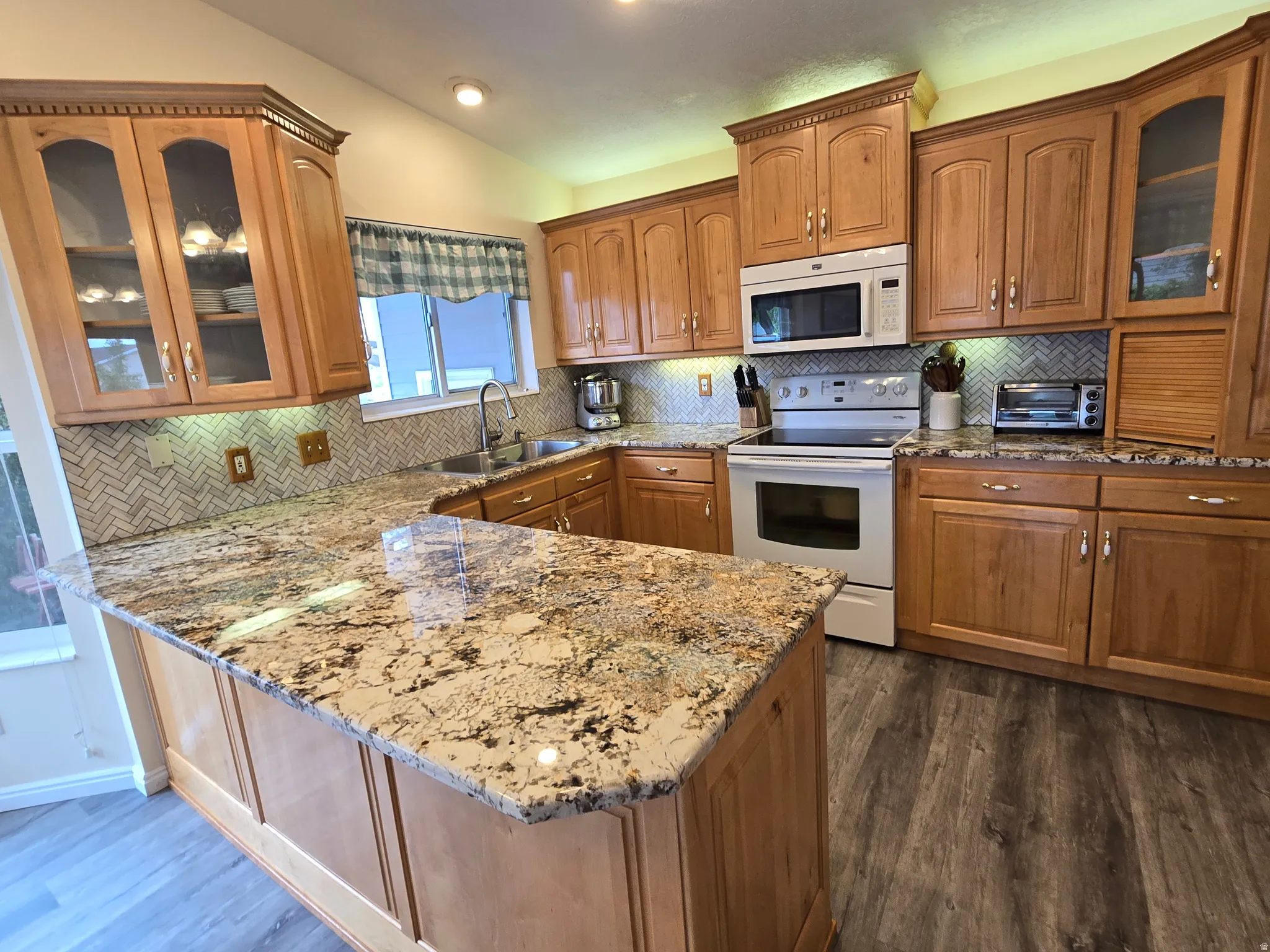 Kitchen featuring maple cabinetry and granite countertops