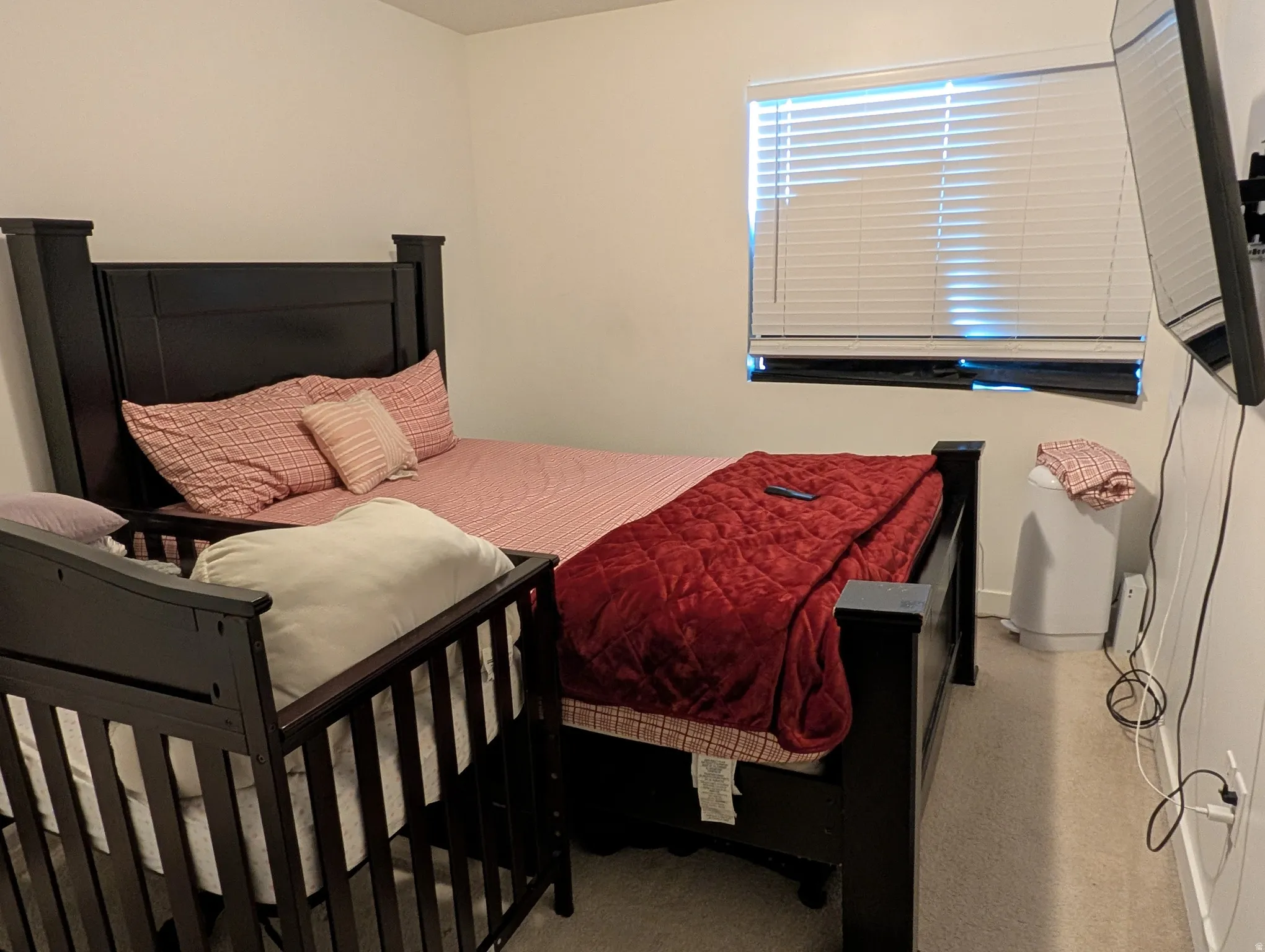 Room featuring light neutral wall paint and carpet flooring