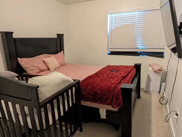 Room featuring light neutral wall paint and carpet flooring