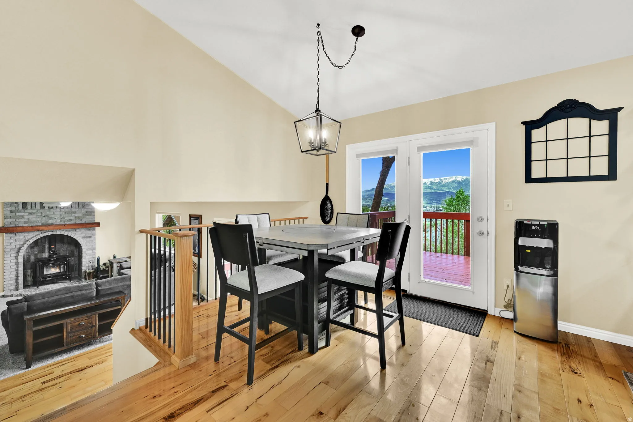 Vaulted ceilings over wood-finish flooring with a multi-level design