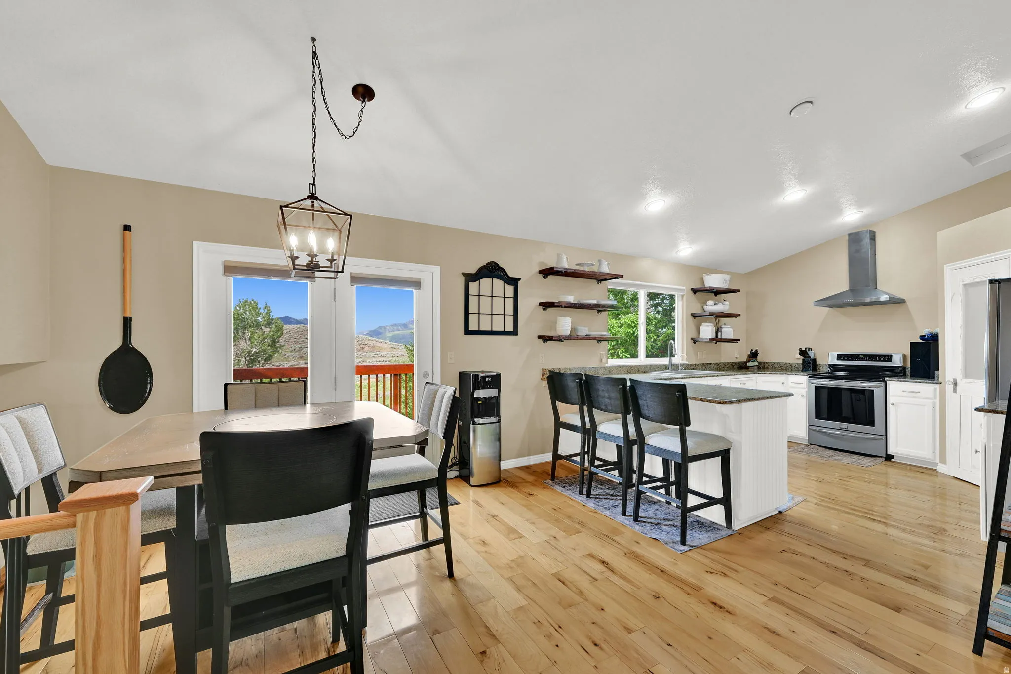 Open concept living area with wood-finish flooring
