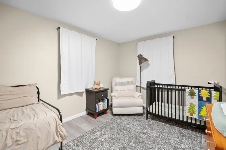 Neutral tone walls with white trim and wood-finish flooring