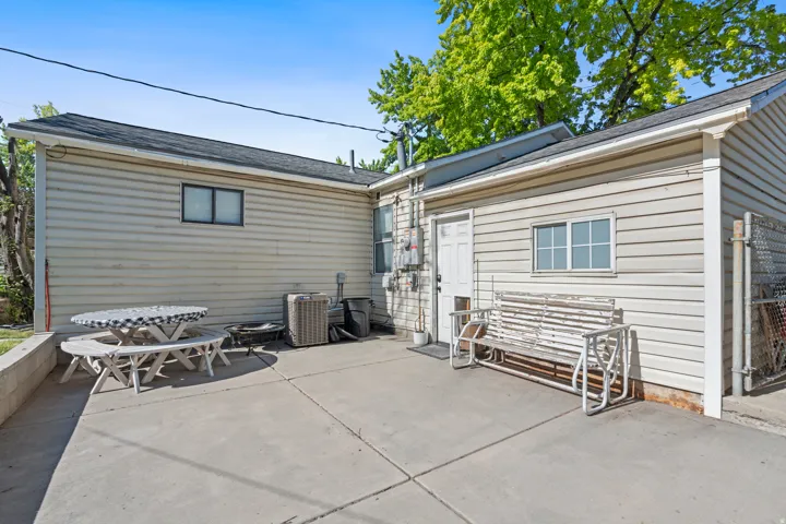 Concrete patio area with horizontal siding exterior