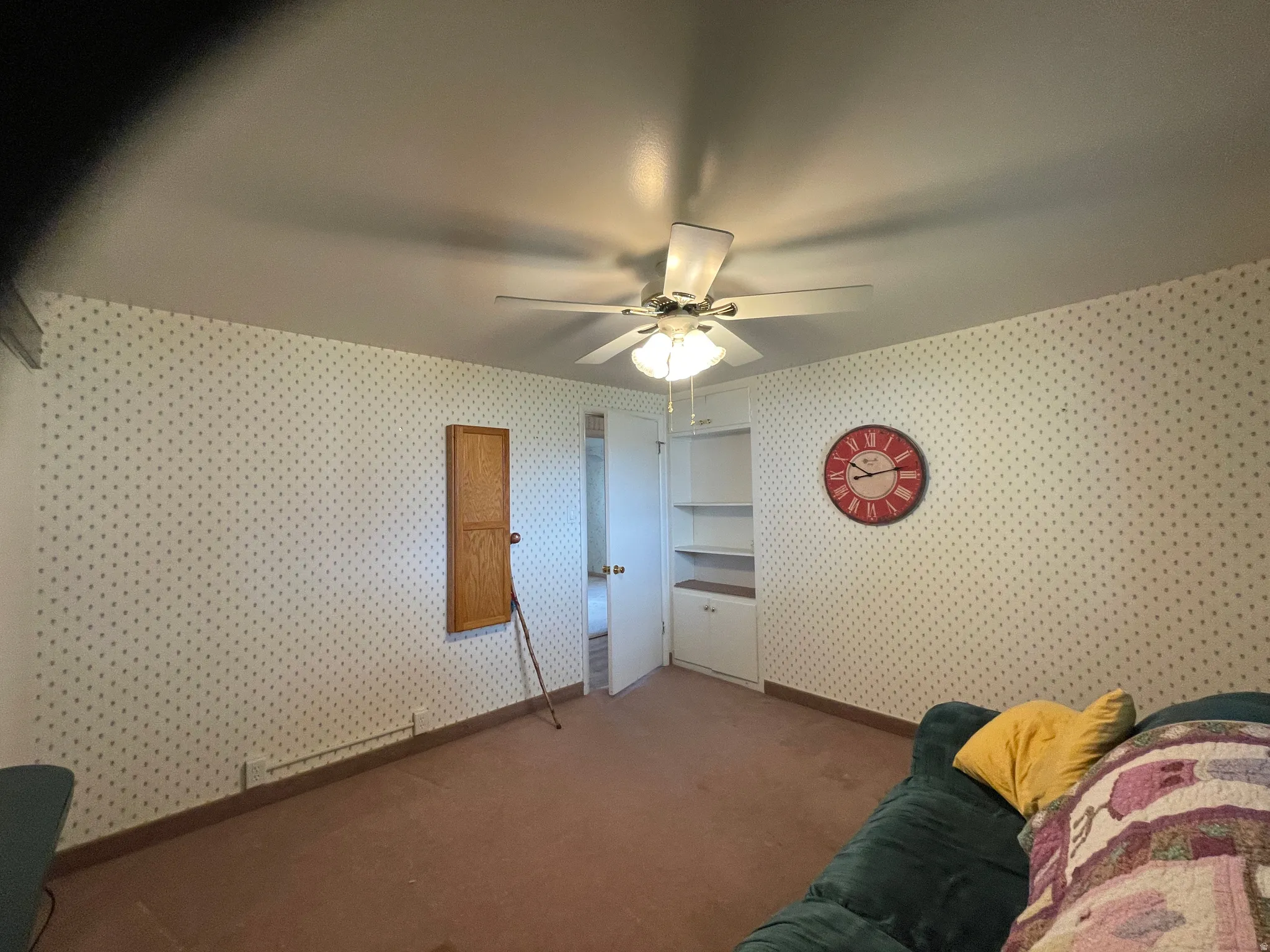 Bedroom used as sewing room additional storage and drip down Ironing board.