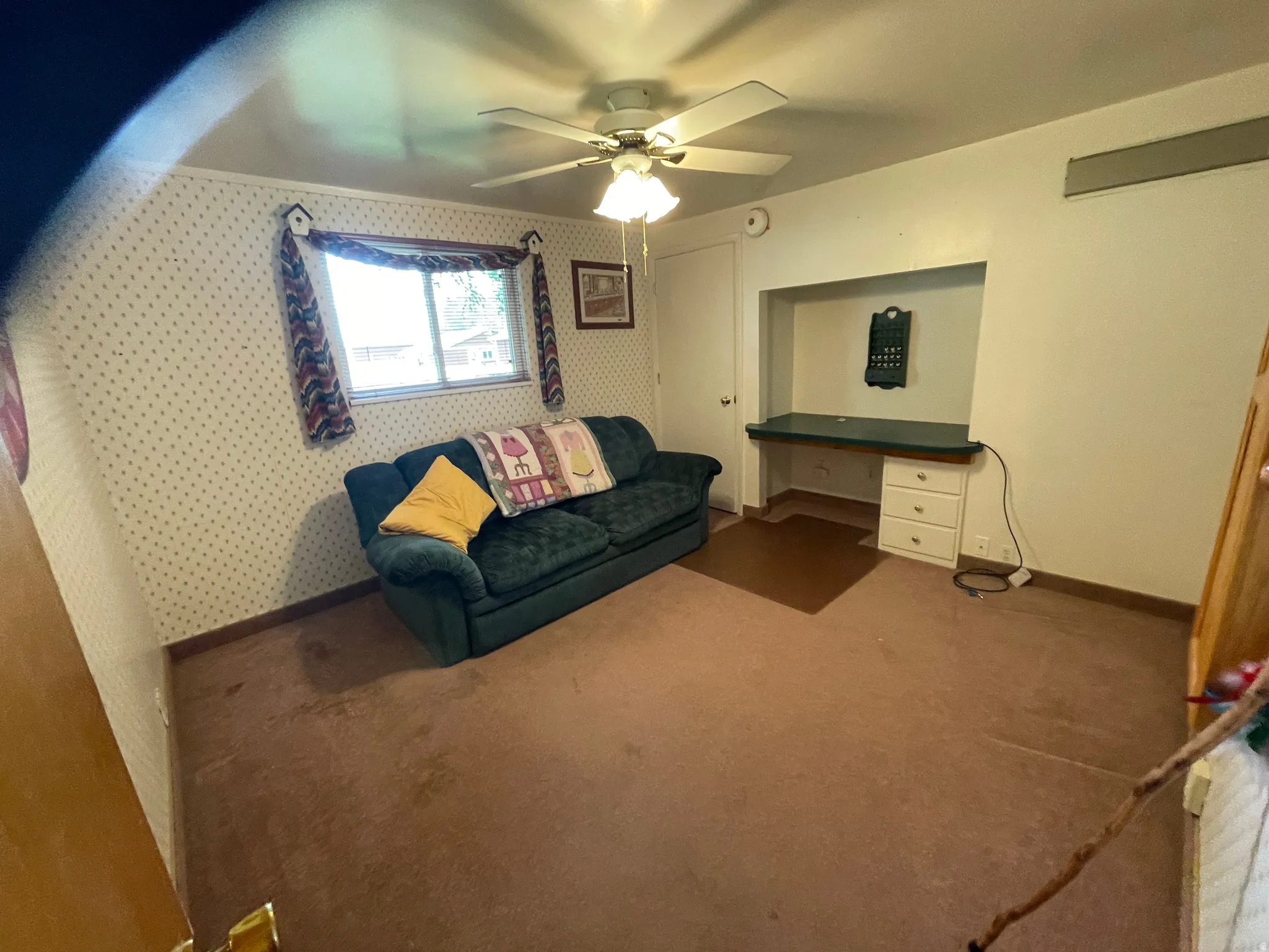 Bedroom used as sewing room with a built in desk