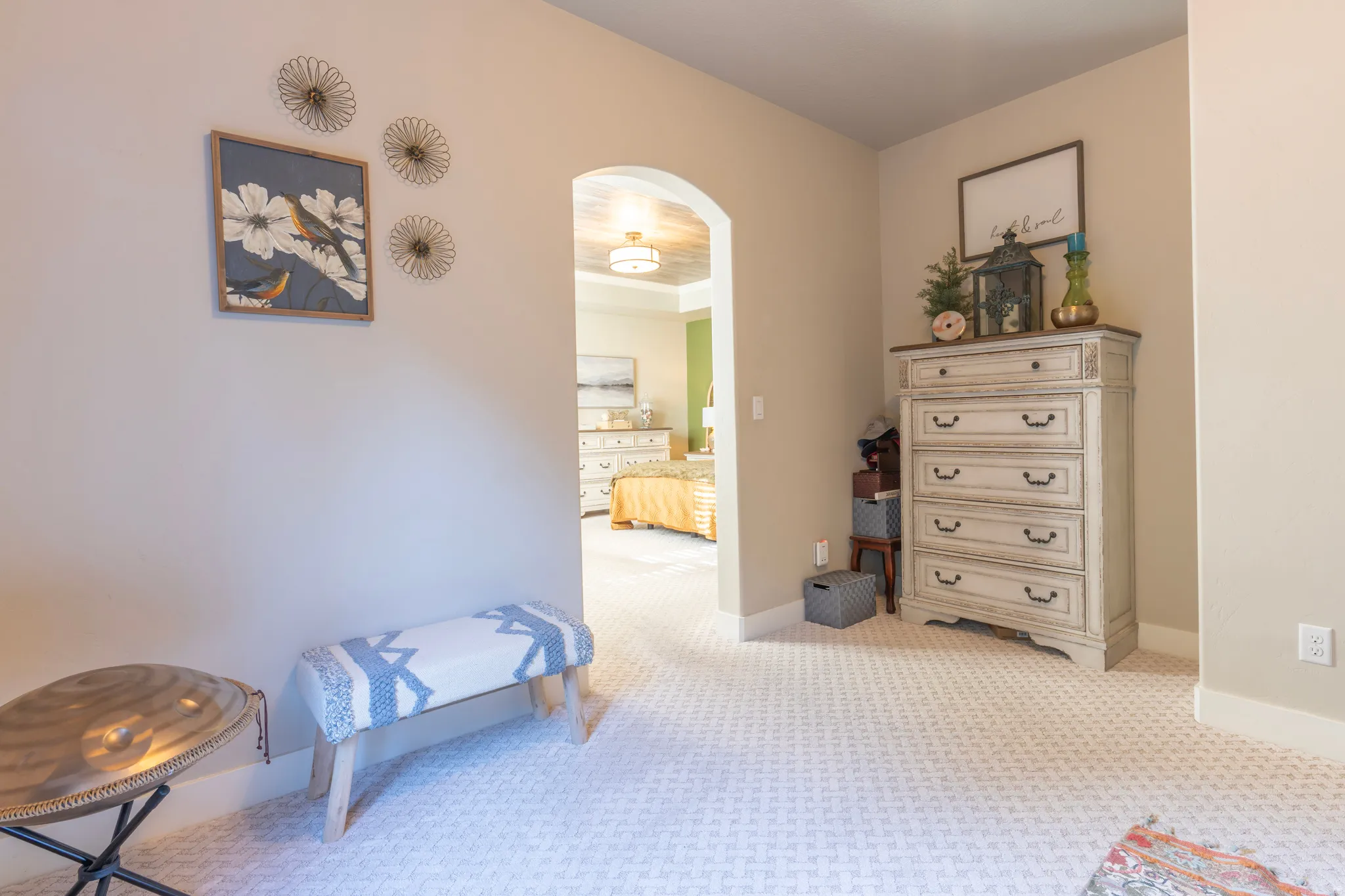 Archway entry leading to a bright room