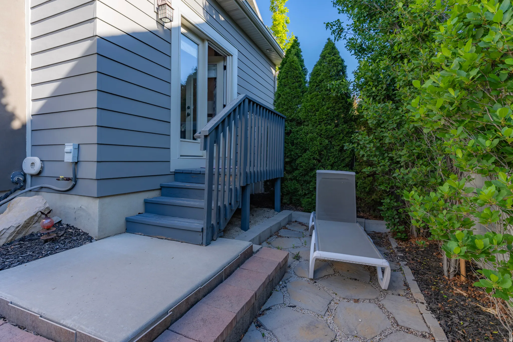 Rear exterior featuring blue-gray horizontal siding
