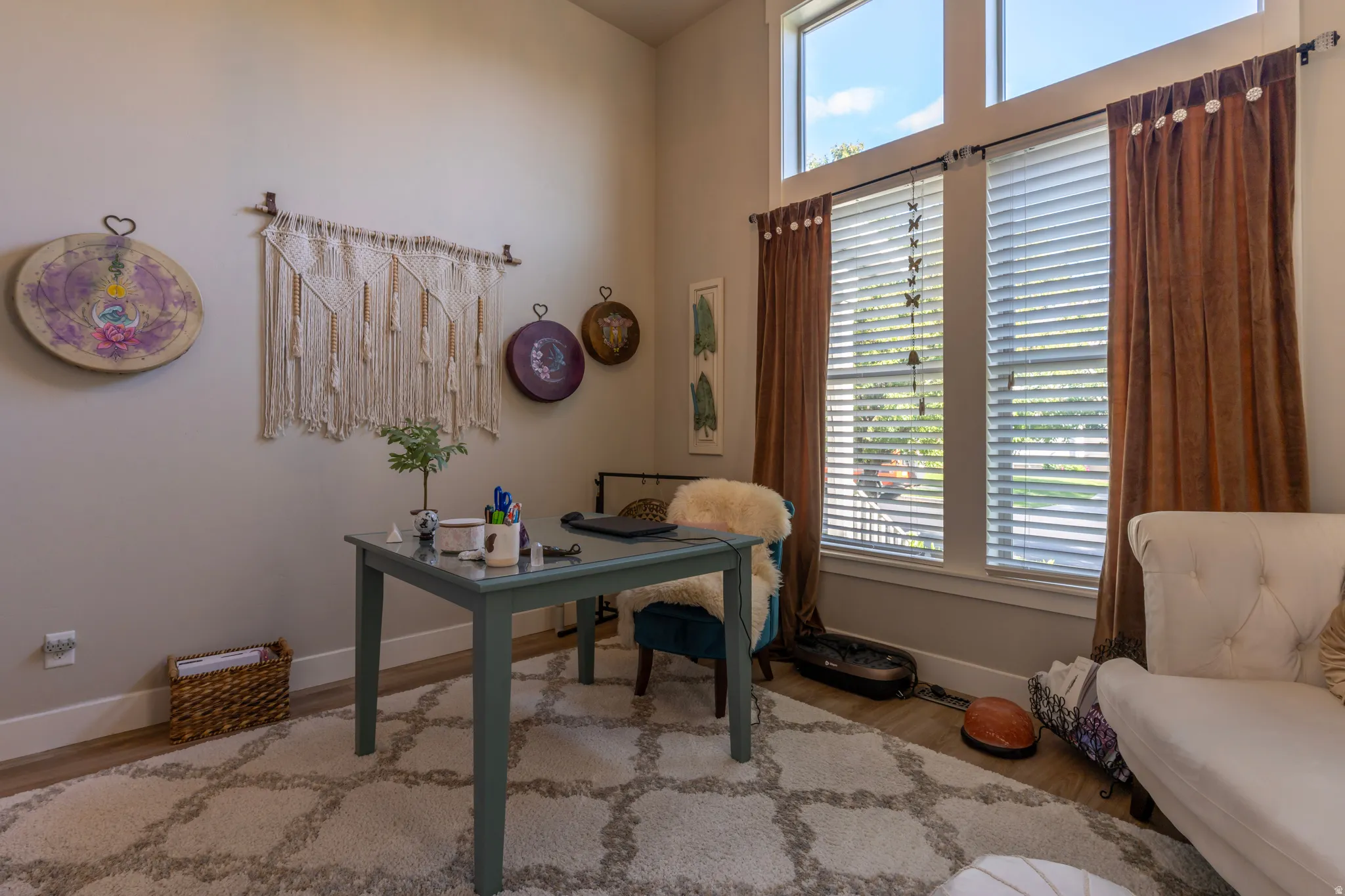 Room featuring a vaulted ceiling and high windows with transom lites