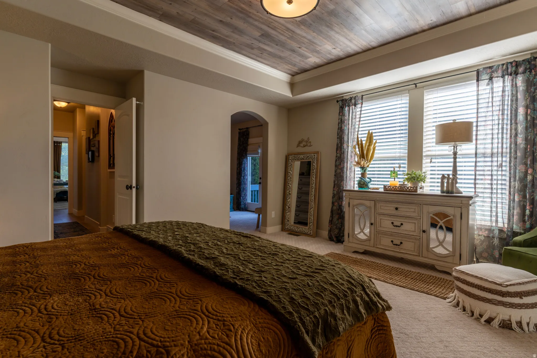 Tray ceiling with wood-finish paneling and an integrated ceiling light fixture