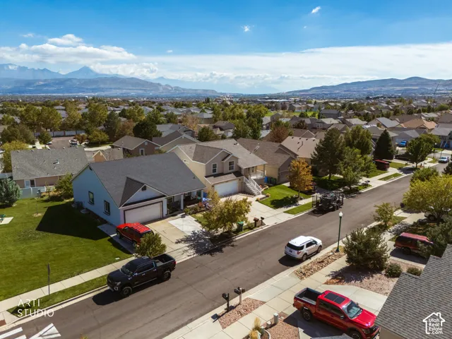 Residential area featuring single-family homes with pitched roofs and attached garages