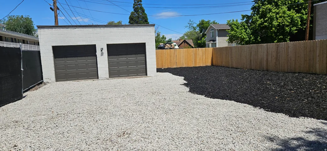 Detached two-car garage with openers.