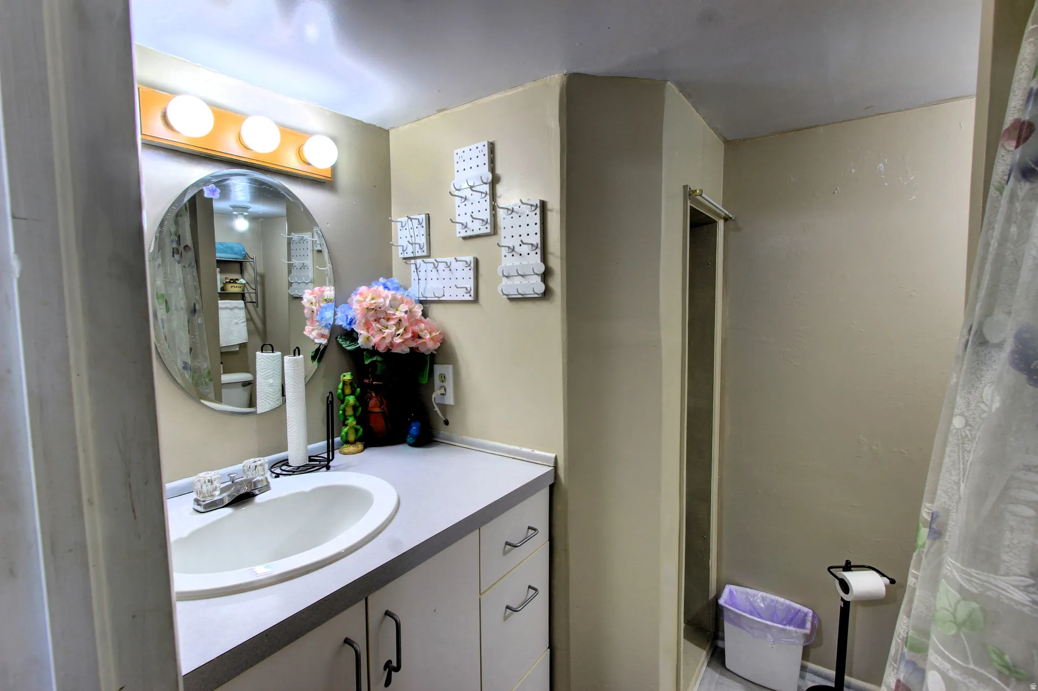 Bathroom featuring a built-in vanity with an integrated sink and base cabinetry