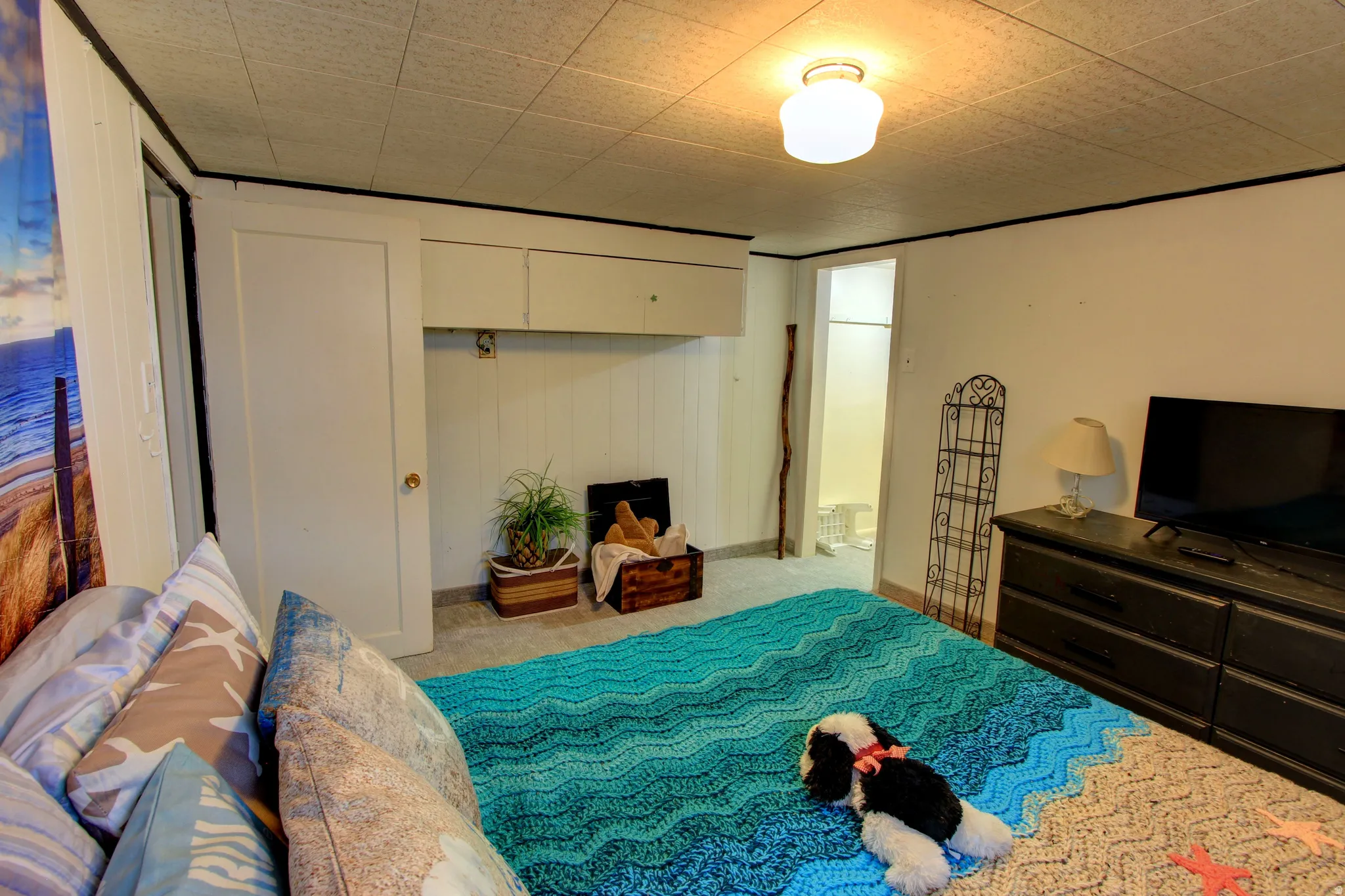 White paneled walls with overhead cabinetry