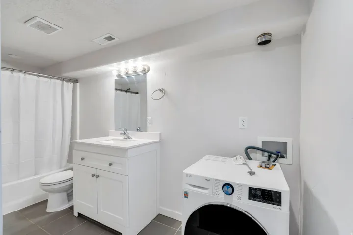 Basement bathroom has washer/dryer hookup