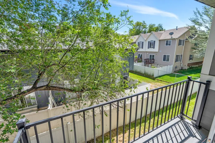 Balcony overlooks backyard
