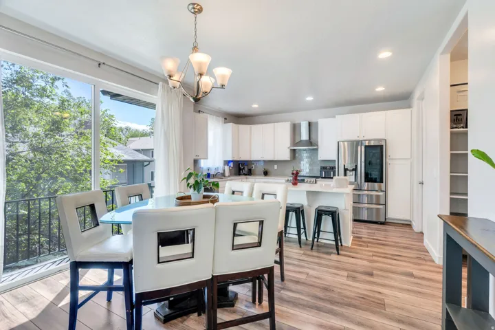 Sliding glass door to deck provides lots of light to kitchen/dining area