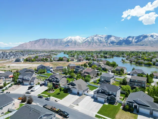 Community featuring a lake and mountain backdrop with established residential properties