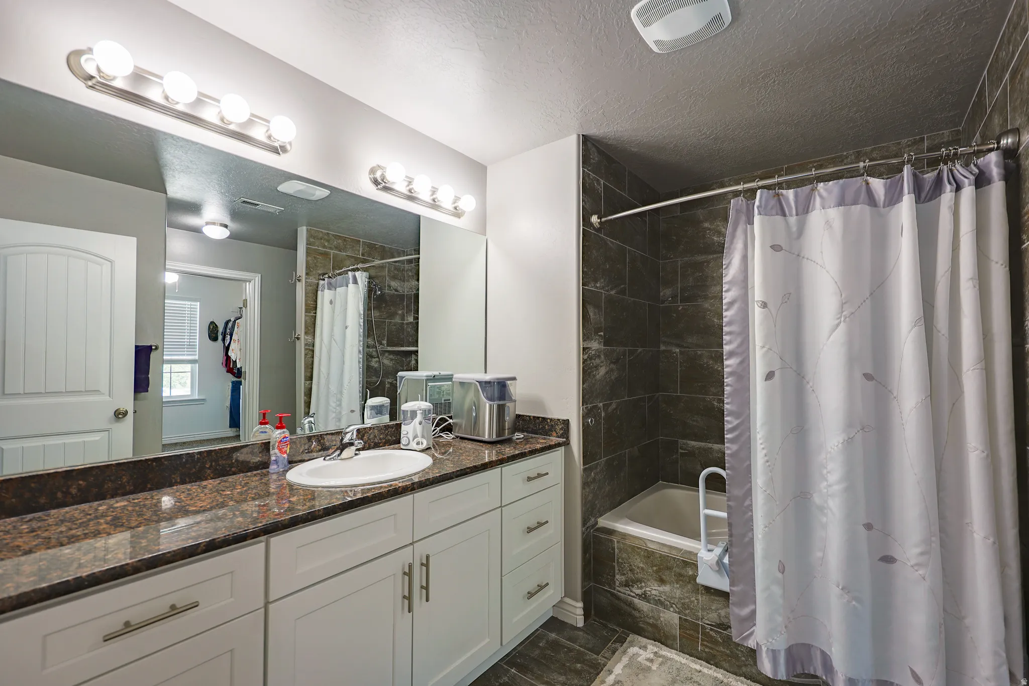 Large Primary Bathroom. Granite counter top. Upgraded tub. Upgraded tile.