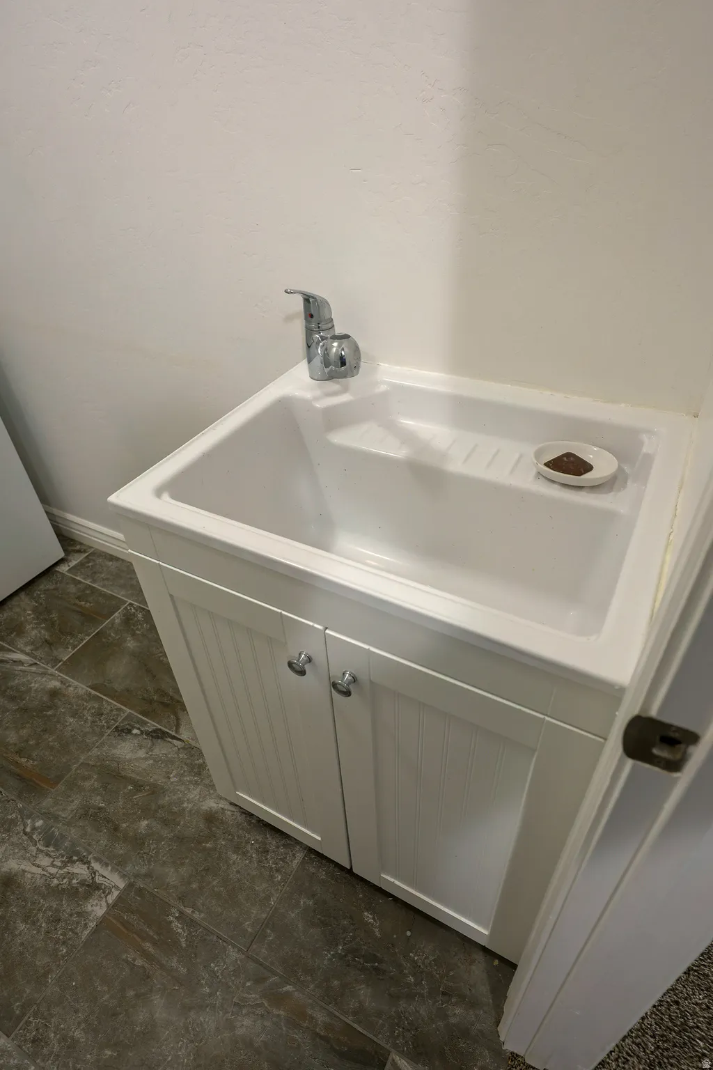 Large convenient sink in the laundry room.