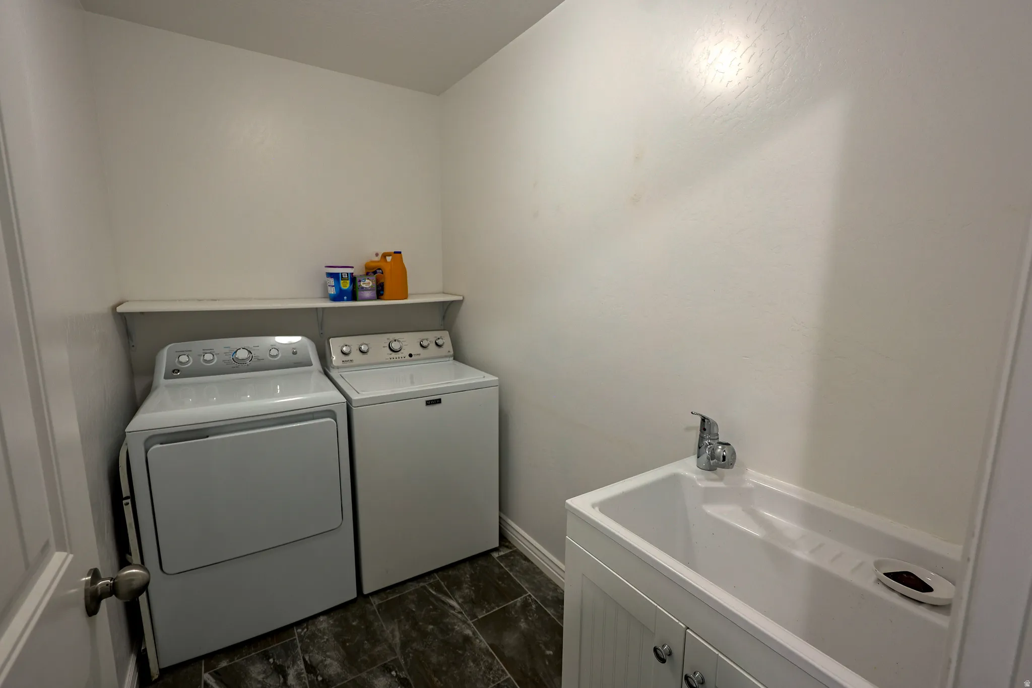 Large laundry room on the same level as 4 bedrooms, very convenient! It has a sink, too!