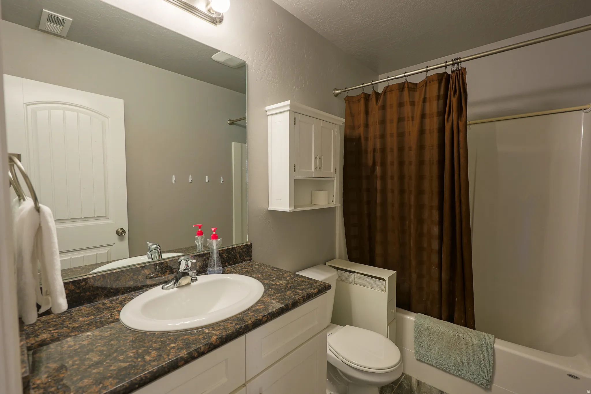 Full bathroom in hall. Granite counter top