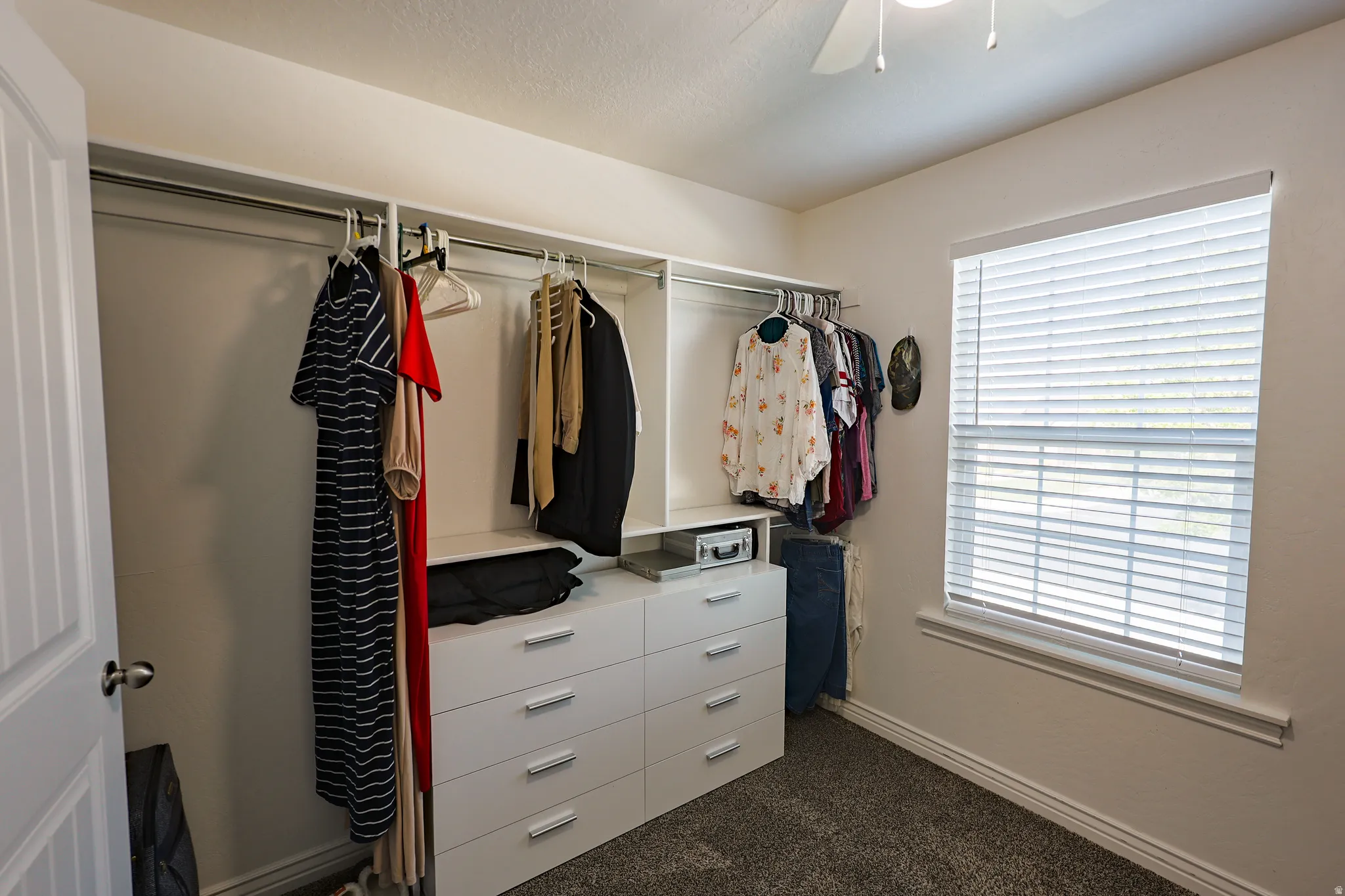 Large Walk-in Closet flowing from Primary Bathroom