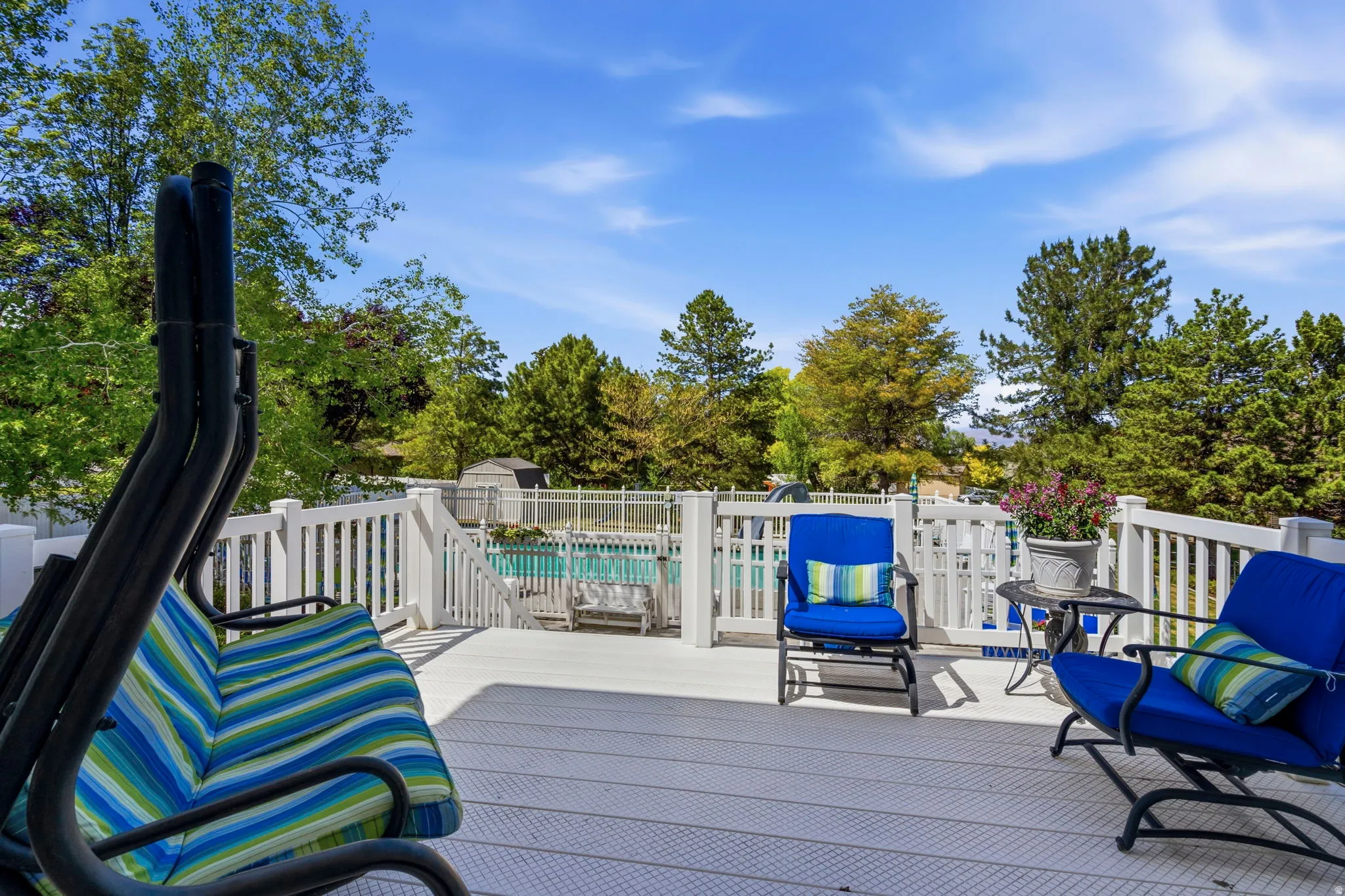 Expansive outdoor deck featuring composite decking and white railing