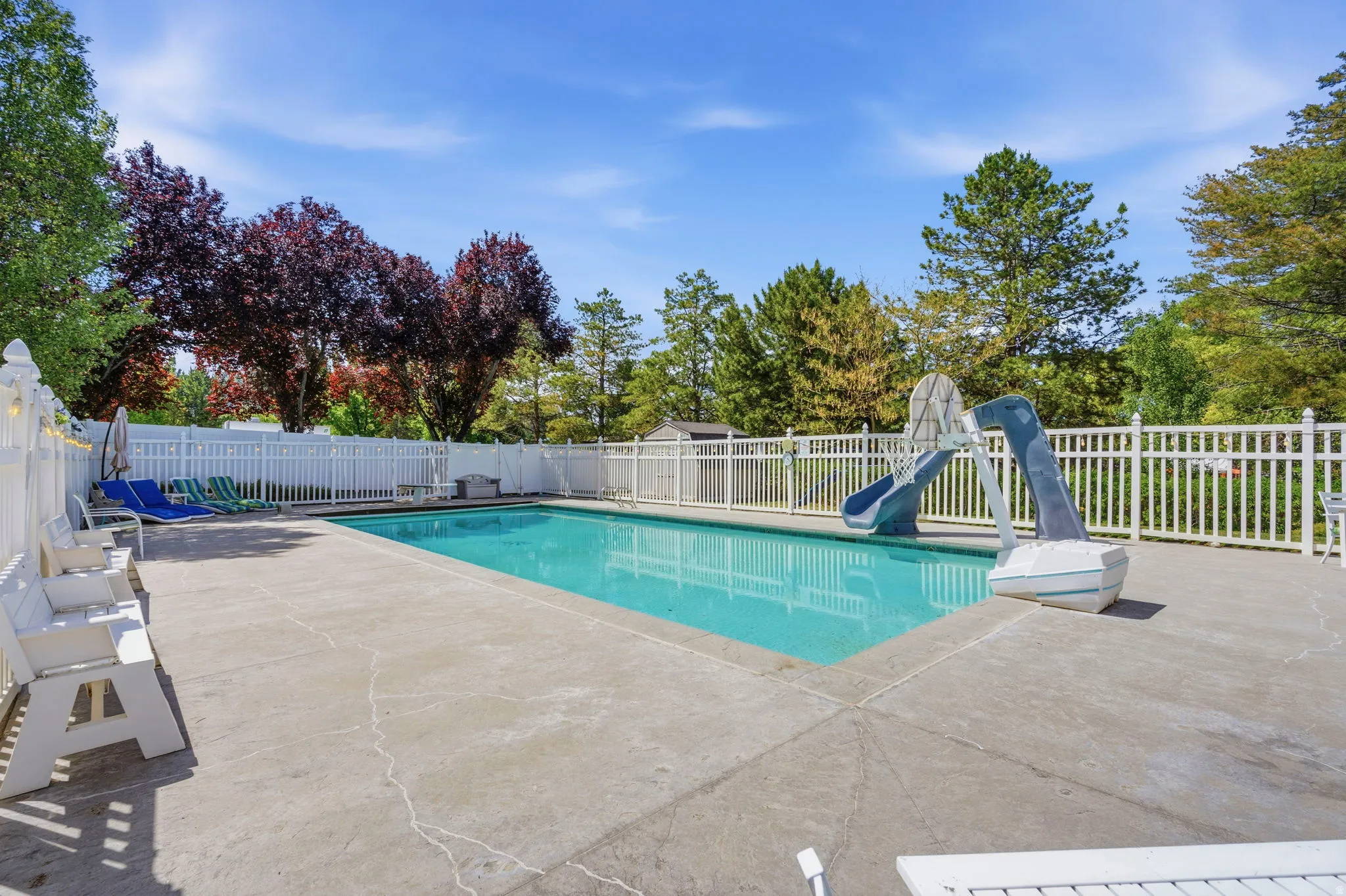 Outdoor swimming pool with concrete surround