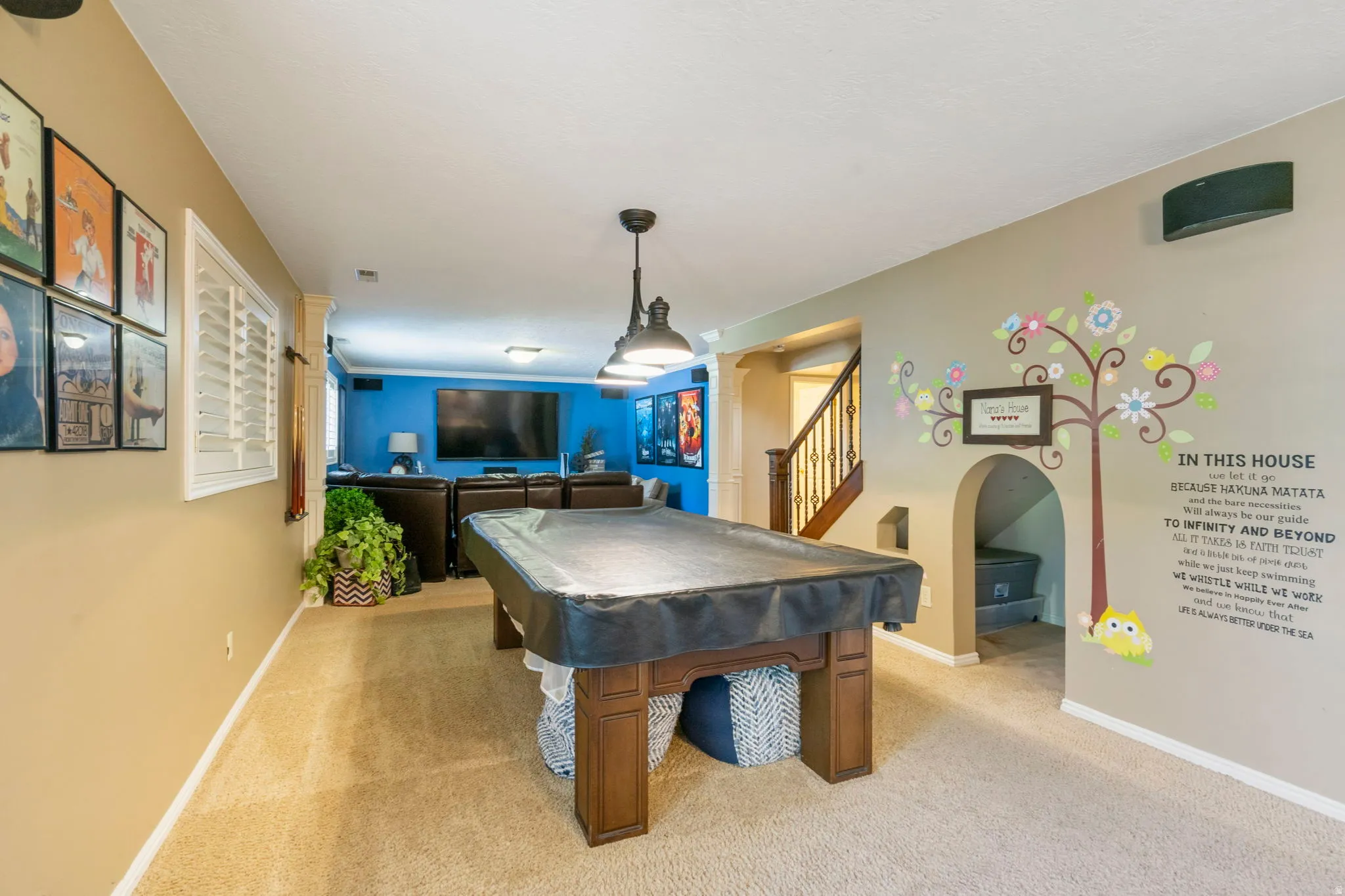 Carpeted recreation room featuring a wooden pool table, recessed lighting, and a built-in archway