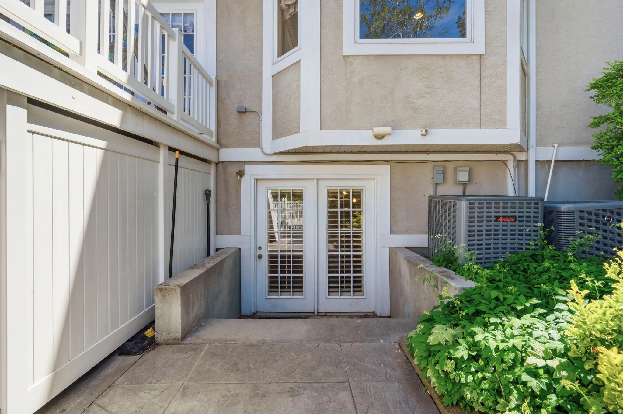 Private patio entry with dual pane French doors