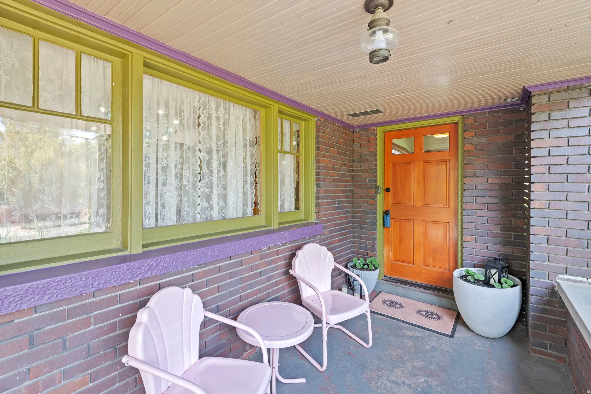 Front covered porch with a space to slow down. So charming and welcoming!