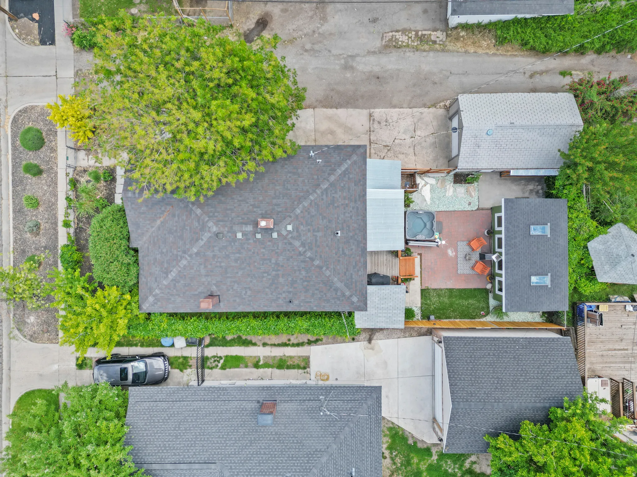 Home, driveway, garage, patio, hot tub,  and covered deck, with studio space make up your own private estate.