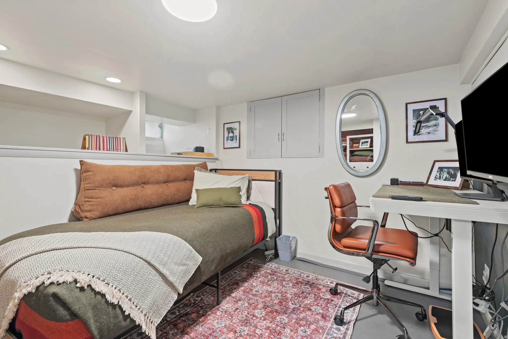 Bedroom 3 with built in storage cabinet and shelf storage