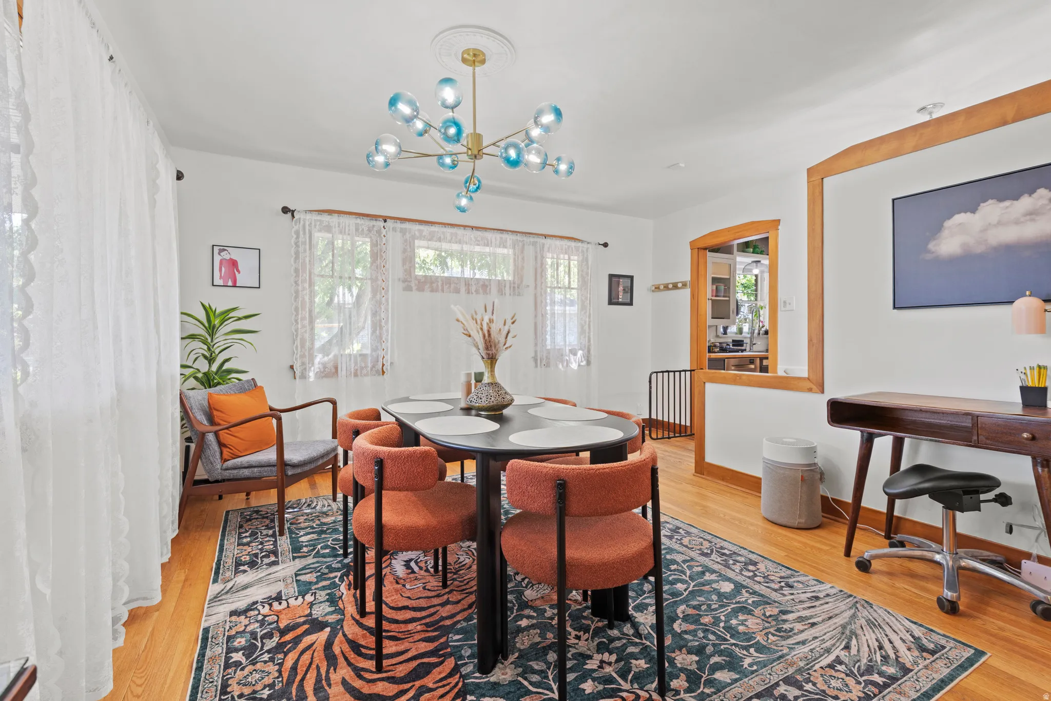 Bright dining area featuring hardwood flooring