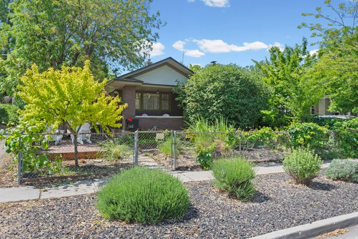 Brick 1927 Bungalow with classic front porch and modern updates for your next home