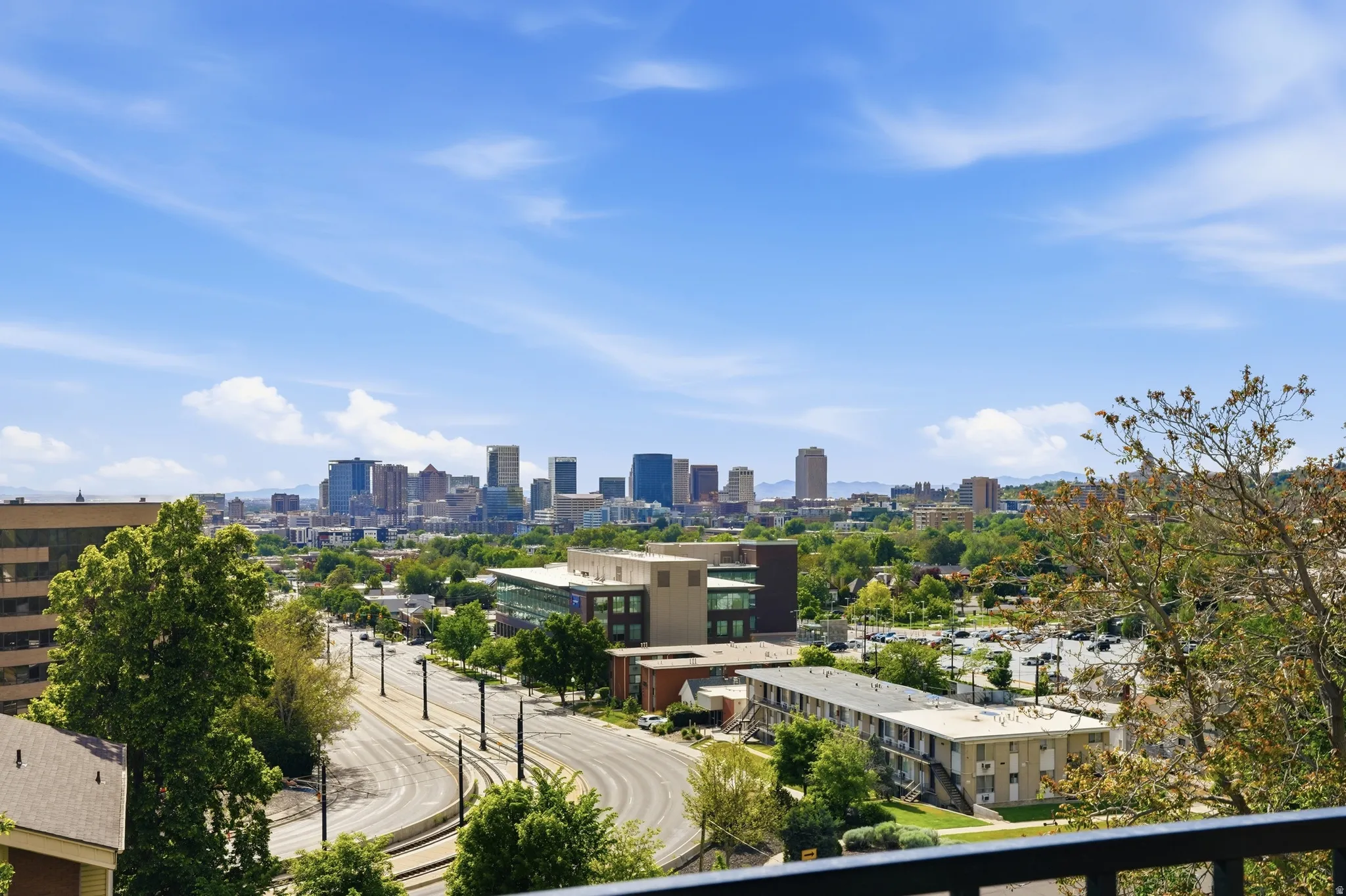 Expansive views of the city, mountains, and sunsets