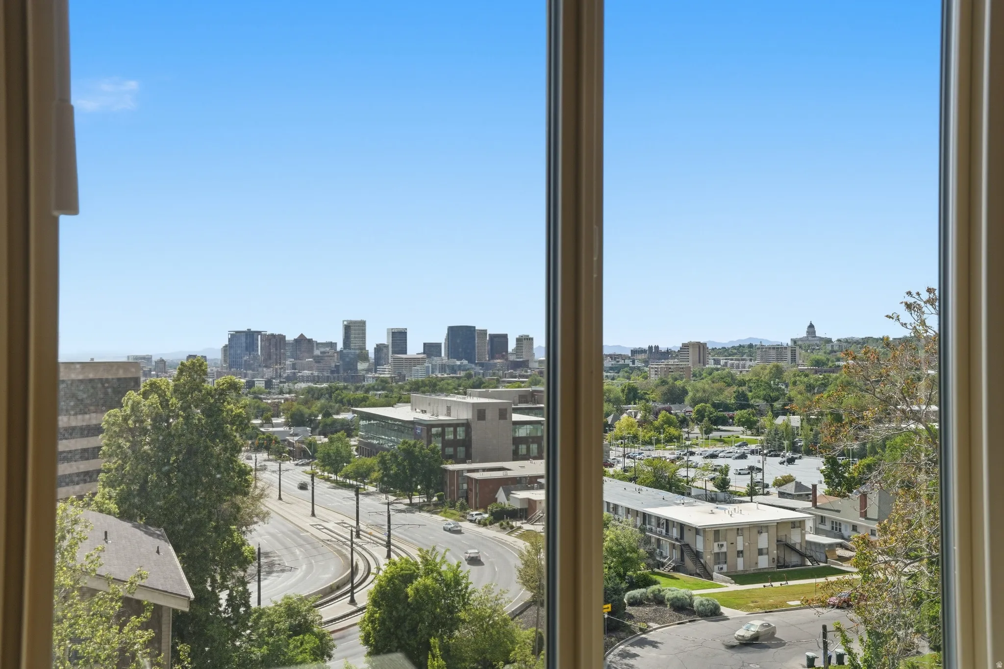 Sliding glass doors in the living room lead to a private balcony with spectacular views of the city
