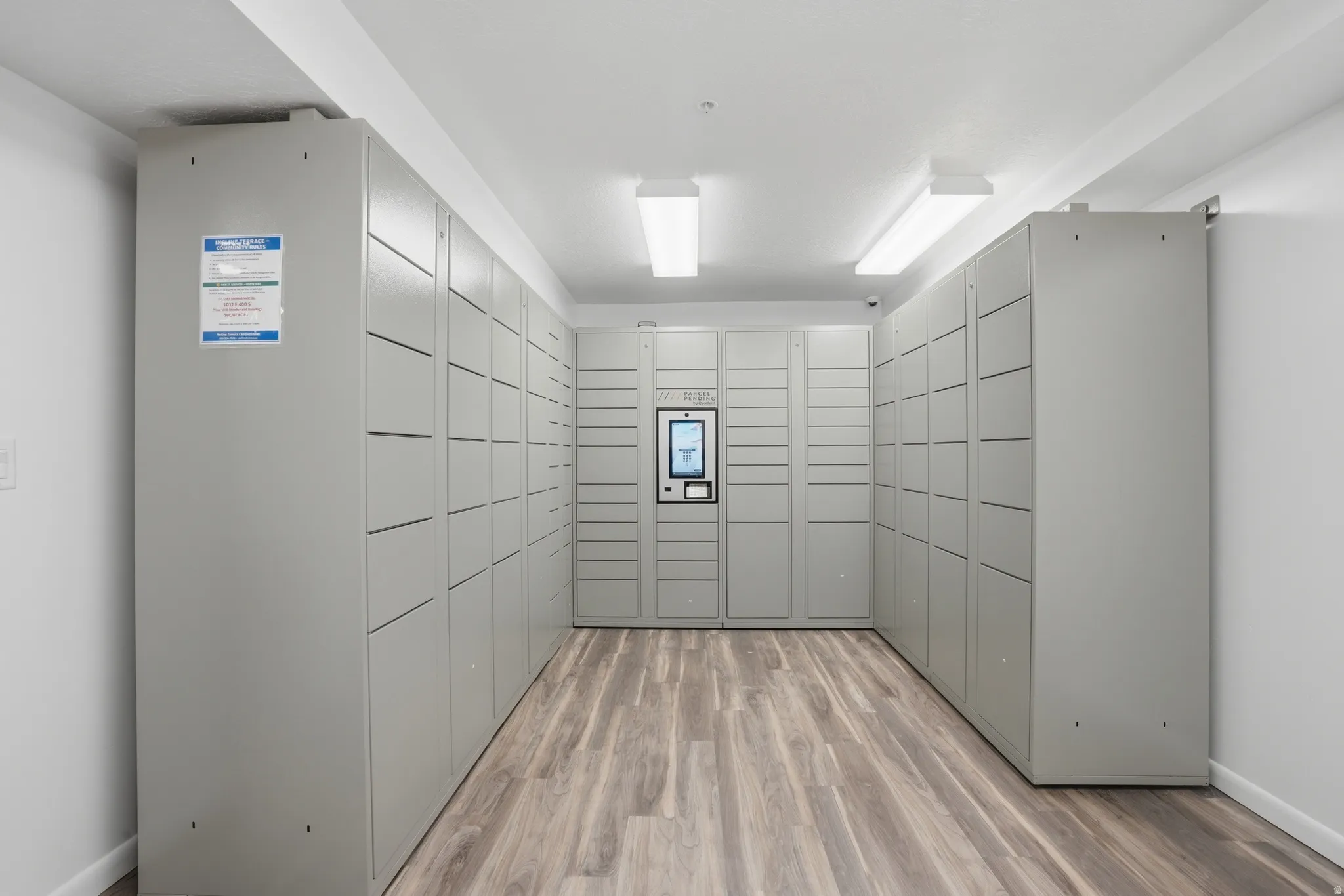 Dedicated parcel locker system featuring a central digital interface
