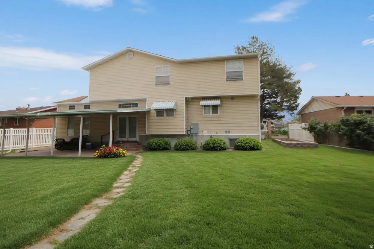 Expansive green lawn with a stone path